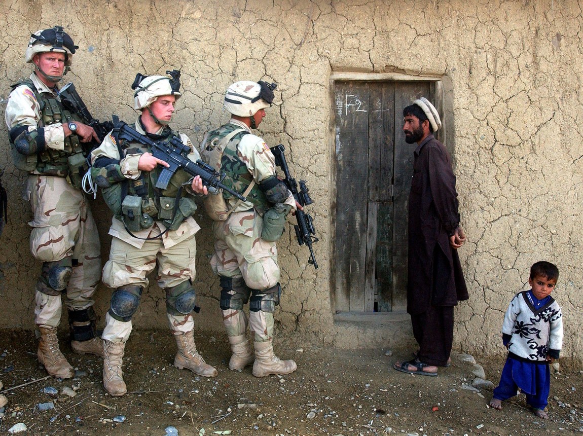 American soldiers searching a home for weapons, southeastern Afghanistan